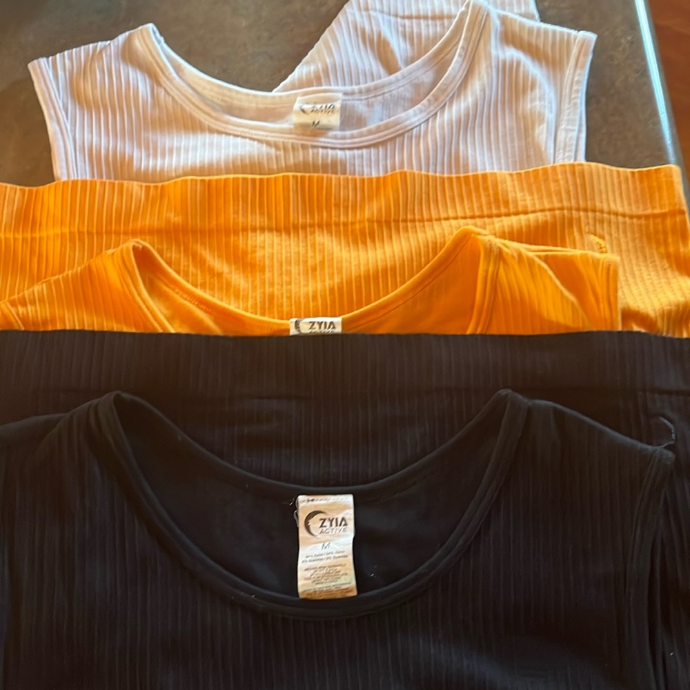Zyia actuve wear Parallel tank. 3 colors. Size medium. White, black and sunset.